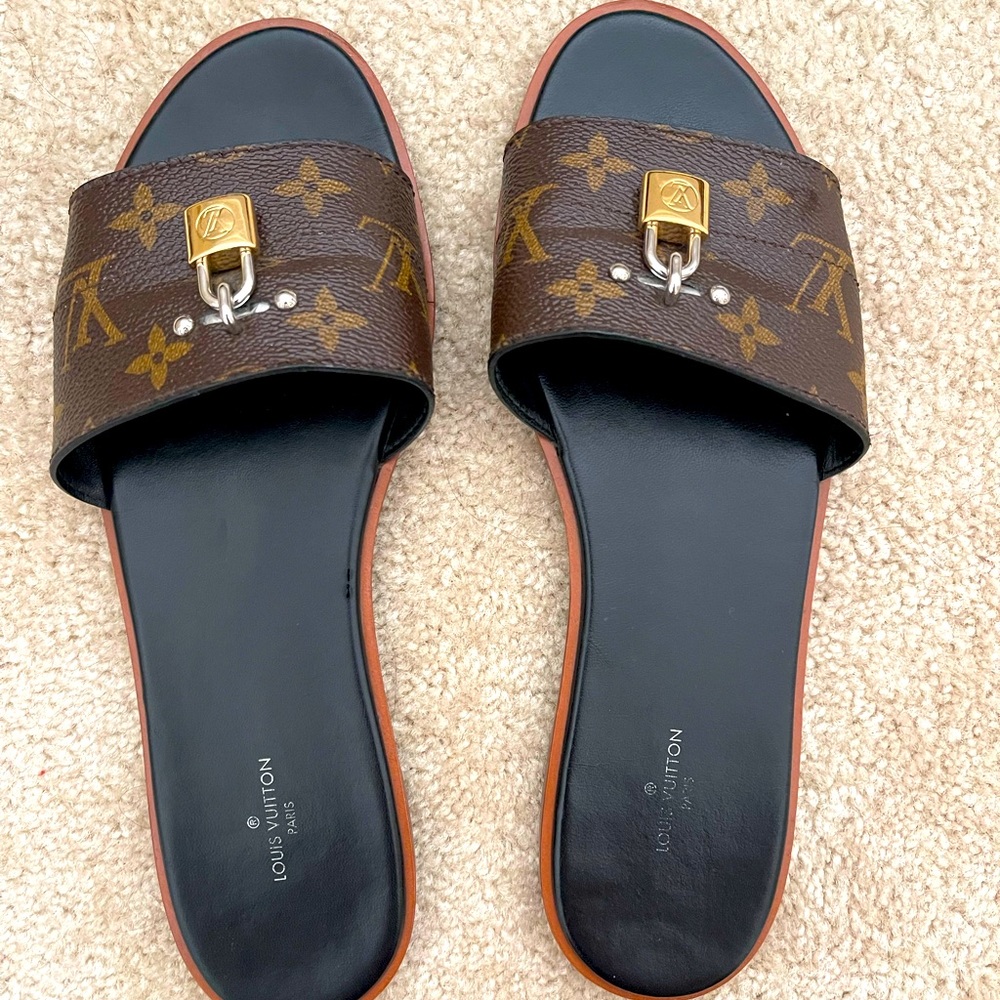Lock it flat Louis Vuitton mules